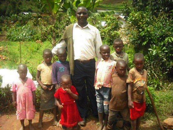 Director One Village Uganda with needy children